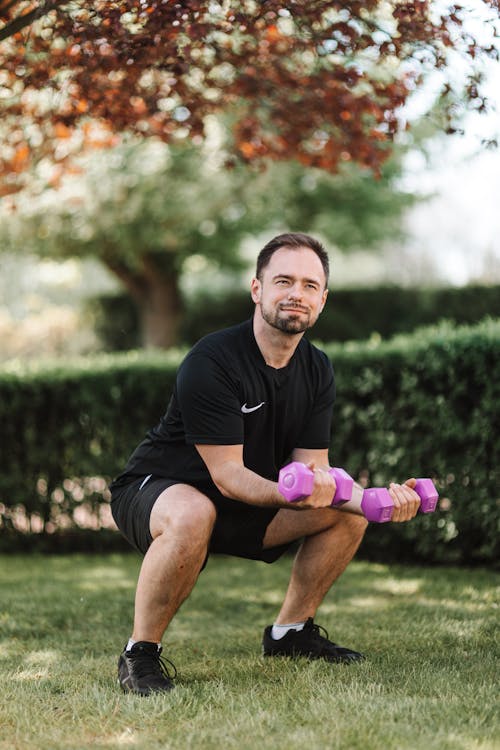 Man in Black Crew Neck T-shirt Exercising Outdoors