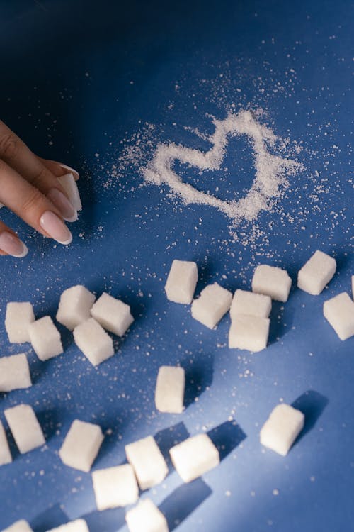 White Sugar Cubes on Blue Surface