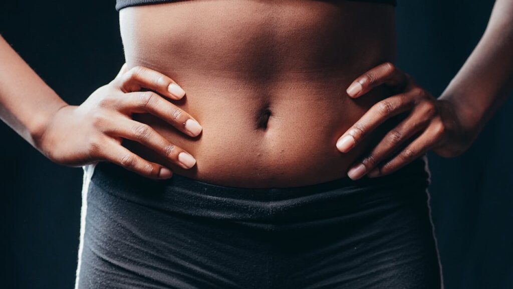 A Person Touching Her Belly