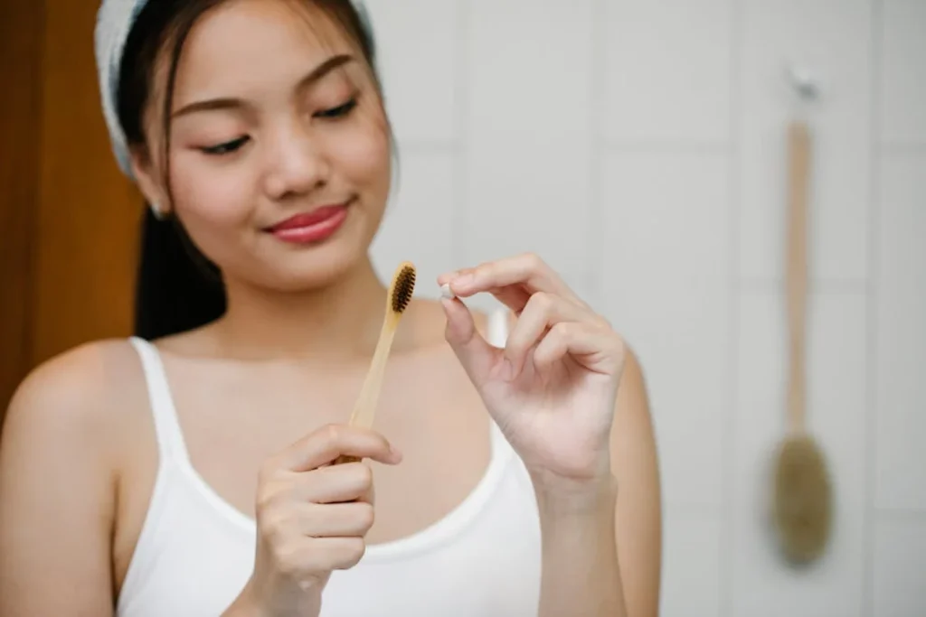 Smiling Asian woman with toothbrush